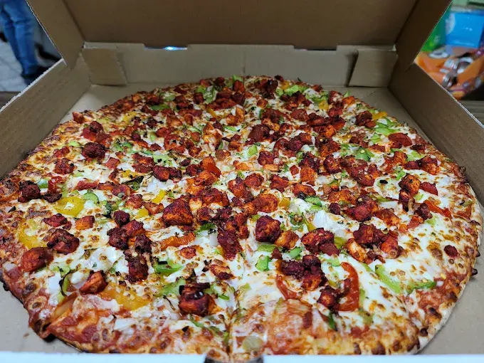 Butter chicken with seasoned rice at ClubHouse Pizza Winnipeg